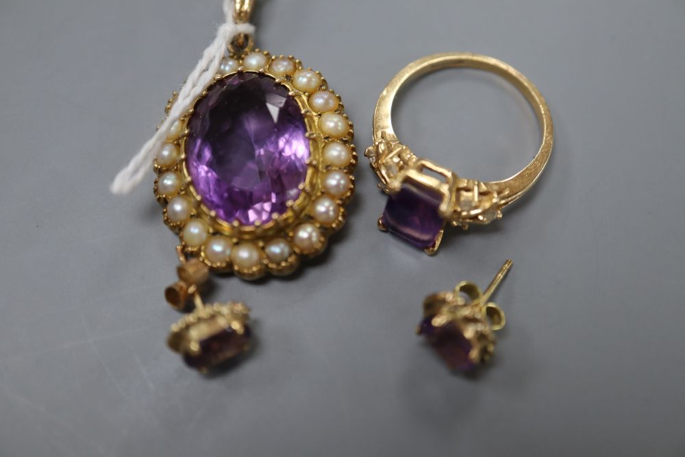 A modern 9ct gold, amethyst and seed pearl set oval pendant, a pair of 9ct and amethyst earstuds and a plated dress ring,